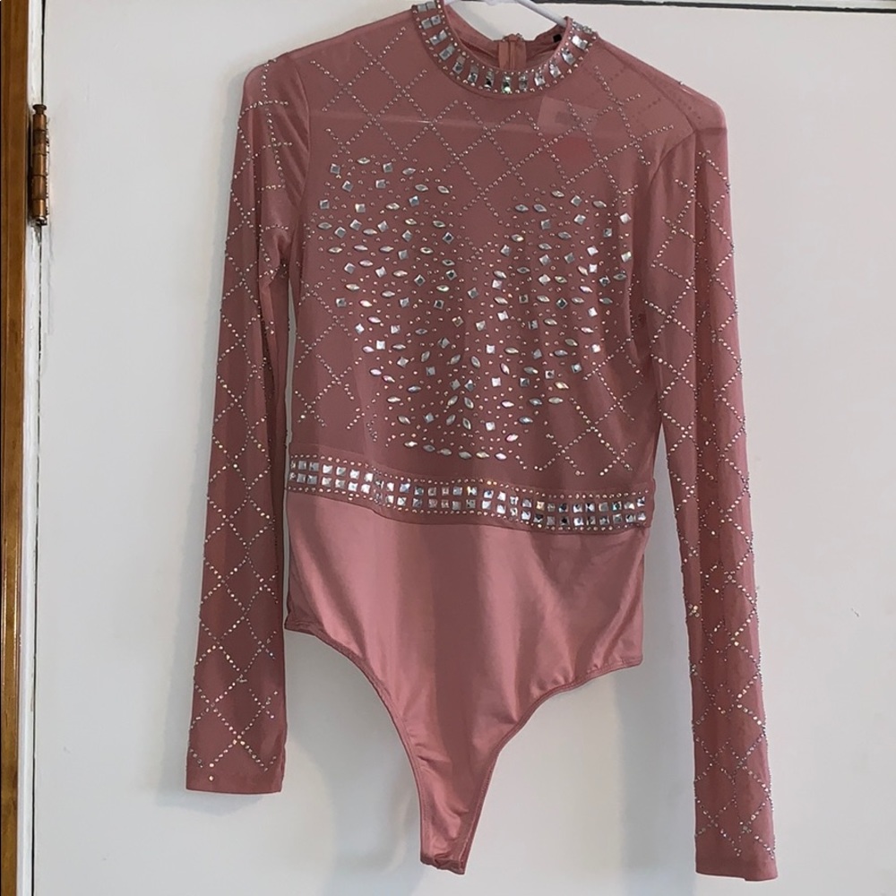 Pink bejeweled body suit